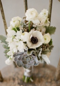 Succulents with hints of grey & blue paired with white flowers makes for a beautiful way to tie together your theme. Source: elizabethannedesigns.com
