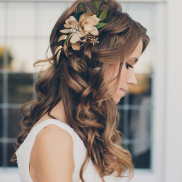 Simply leaving your hair down with a feature flower can be just as amazing as any up-do. If your dress is all sparkle, consider this! Source: ladydress.hubpages.com